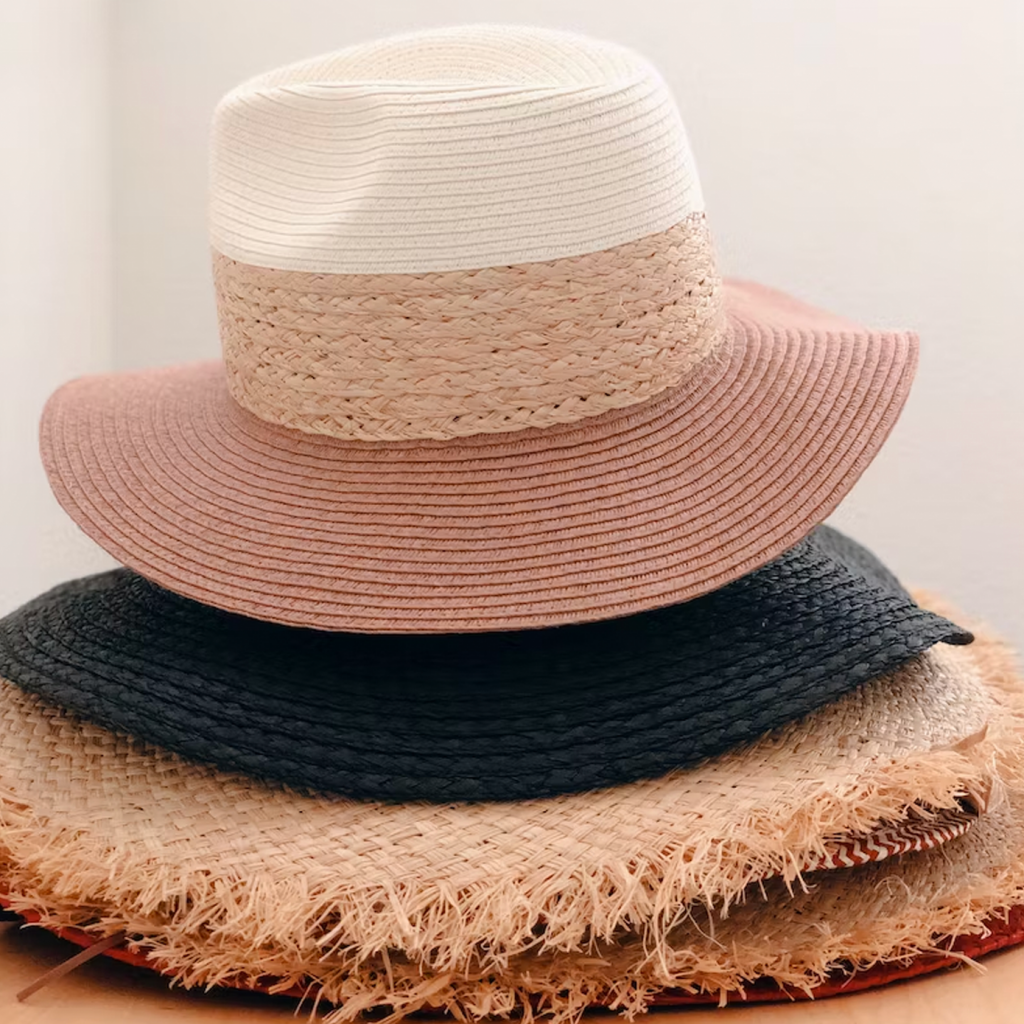A pile of straw hats