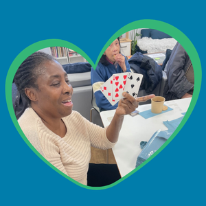 A woman holding playing cards